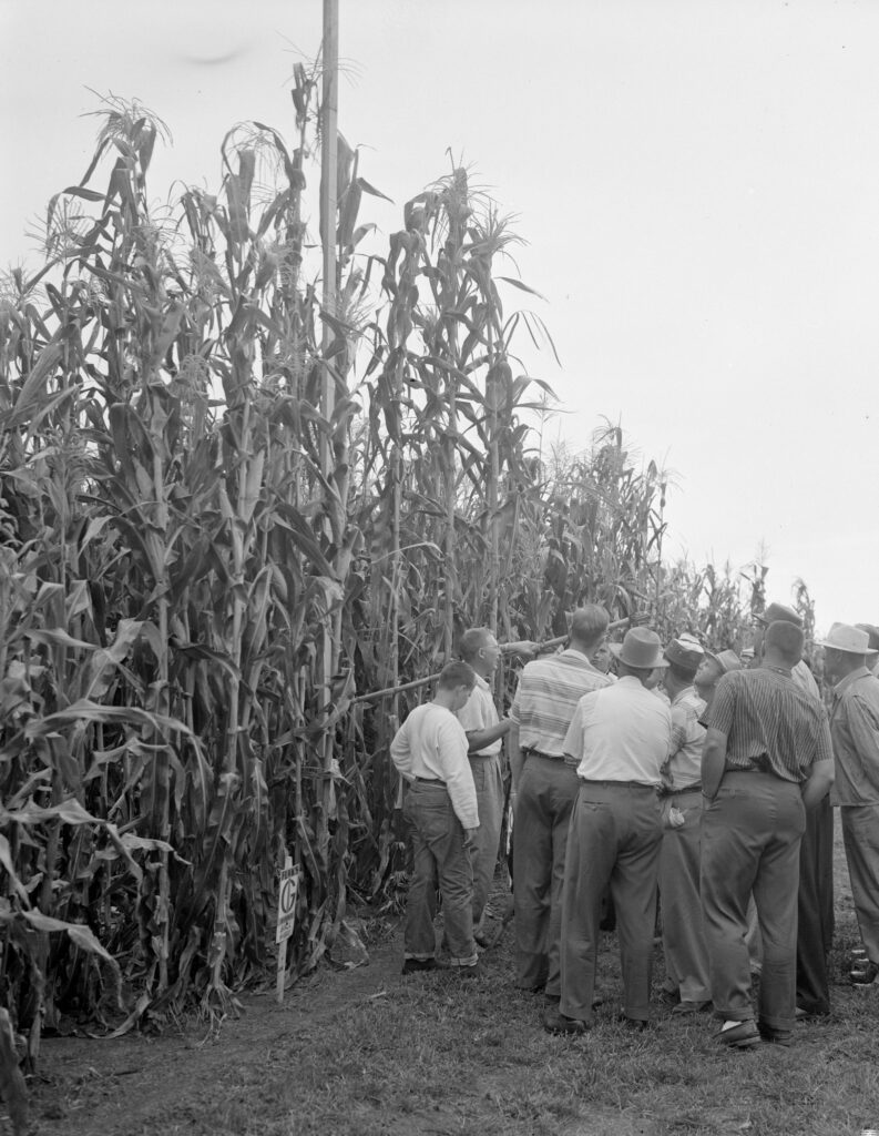 Men touring Funks Research Acres in 1958
